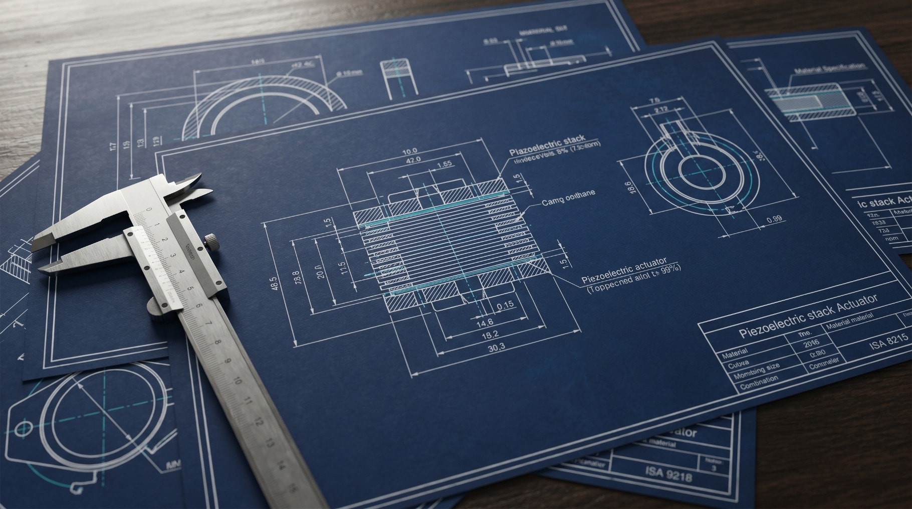 Engineering drawings on a precision drafting table